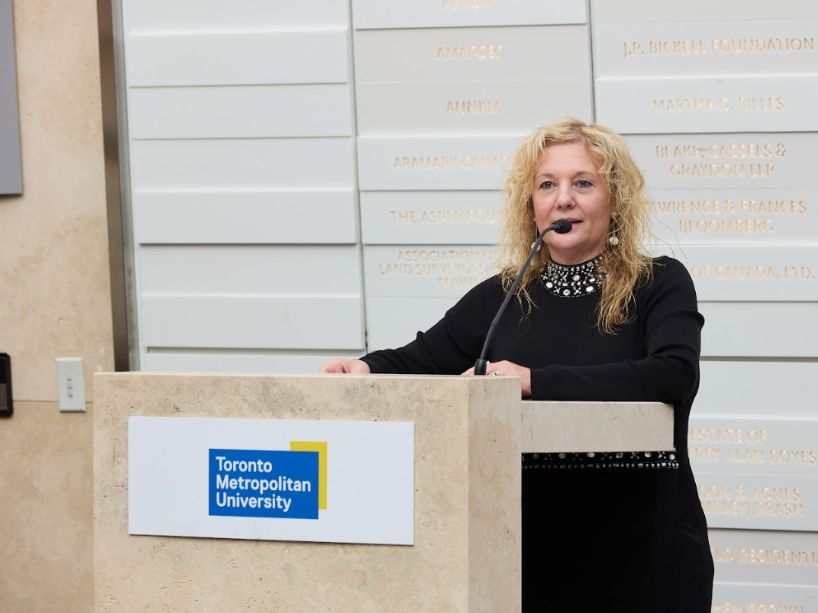 Roberta Iannacito-Provenzano at podium.