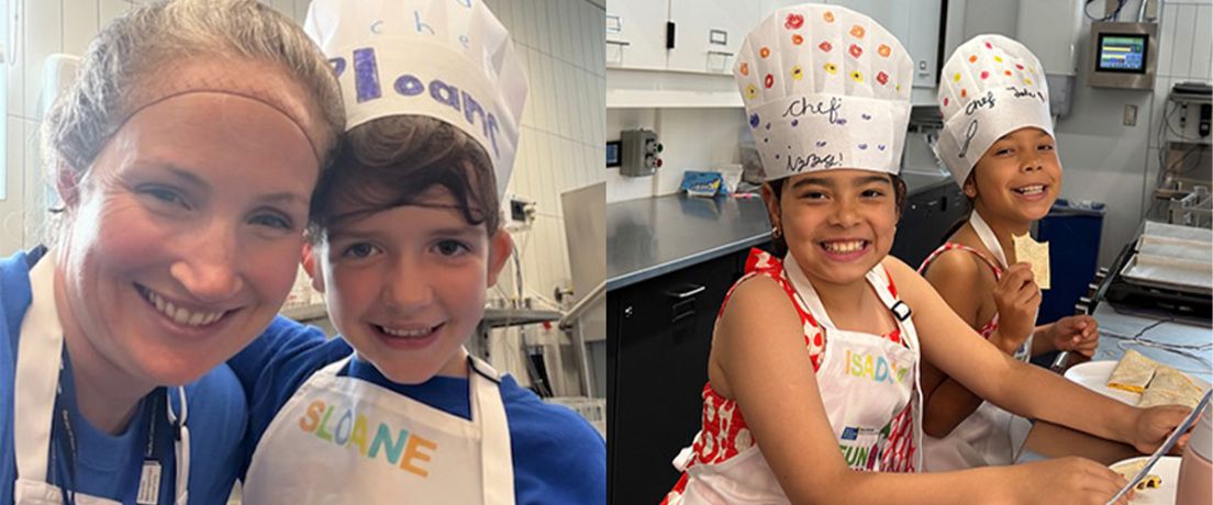Children smiling and posing with chef hats 