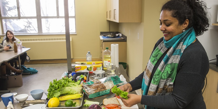 Nutrition instructor preparing foods at kitchen counter