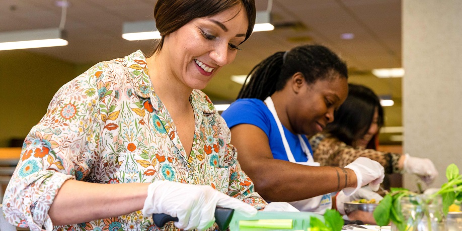 Nutrition students chopping vegetables