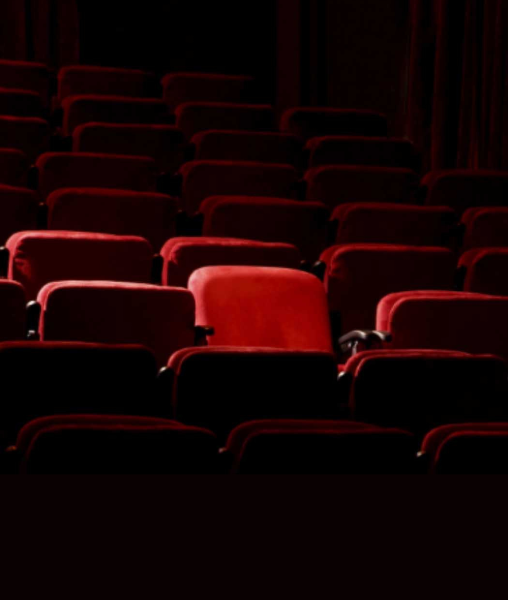 empty red theatre chairs 