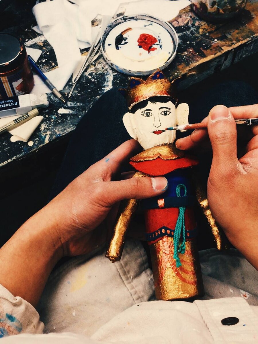 a figurine being painted