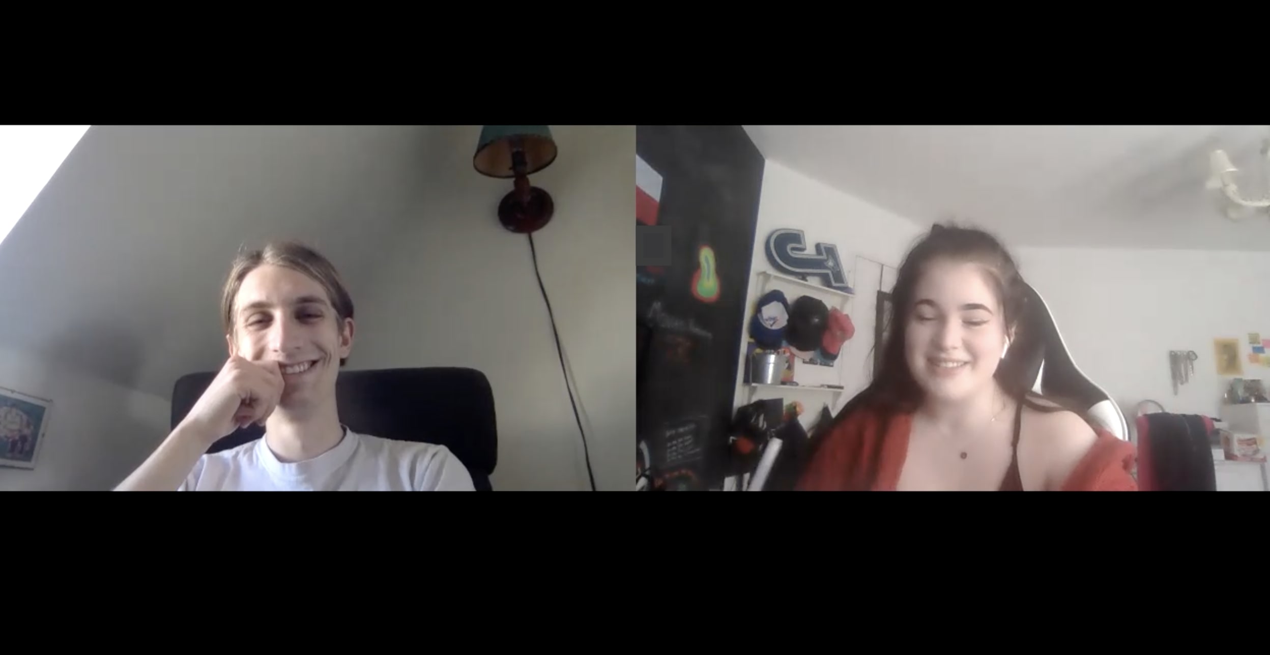 a still from a zoom call, two students smile