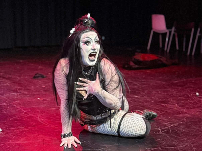 Alexander onstage in a Drag performance.