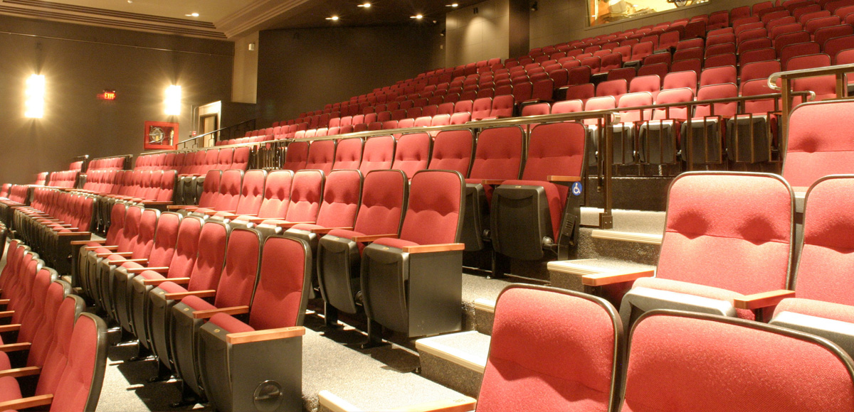 Red chairs in the balcony of the Ryerson Theatre audience.