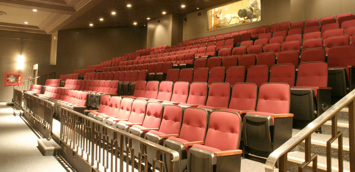 Red chairs in the balcony of the Ryerson Theatre audience.