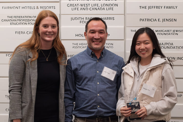 Laura Baker & Dr. John Shiga posing with award winner Maggie Zhu