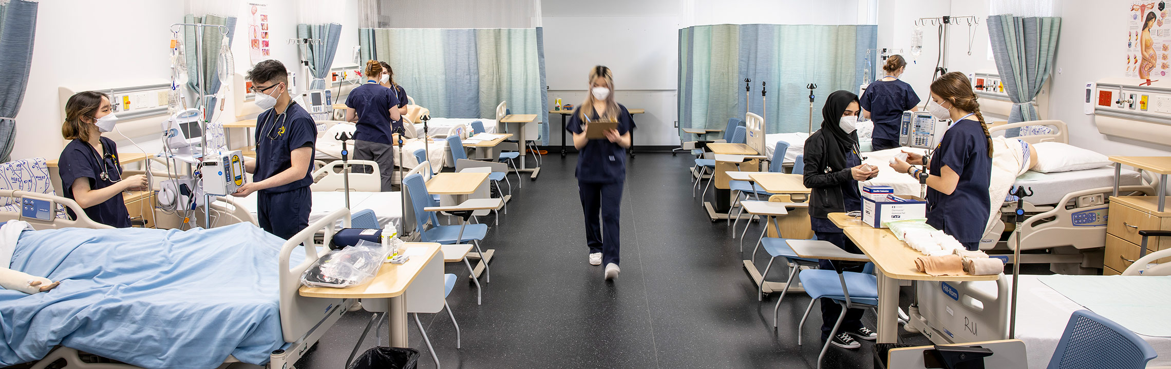 Students in uniforms in a practice medical clinic