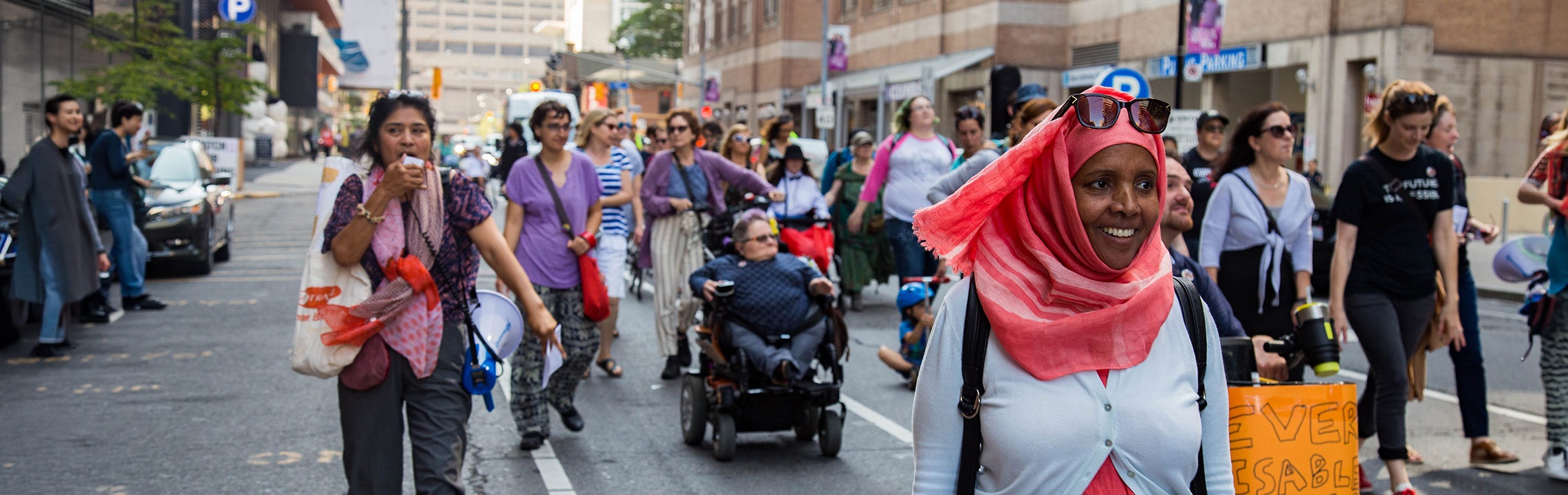 People marching in a protest for disability rights