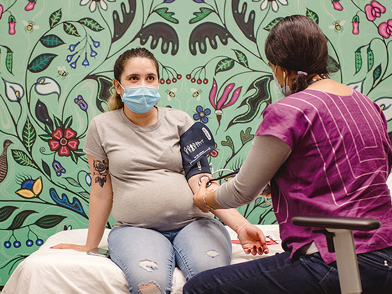 Midwife Laura Solis meets client Vianey De La Torre for a prenatal checkup at the Toronto Birth Centre