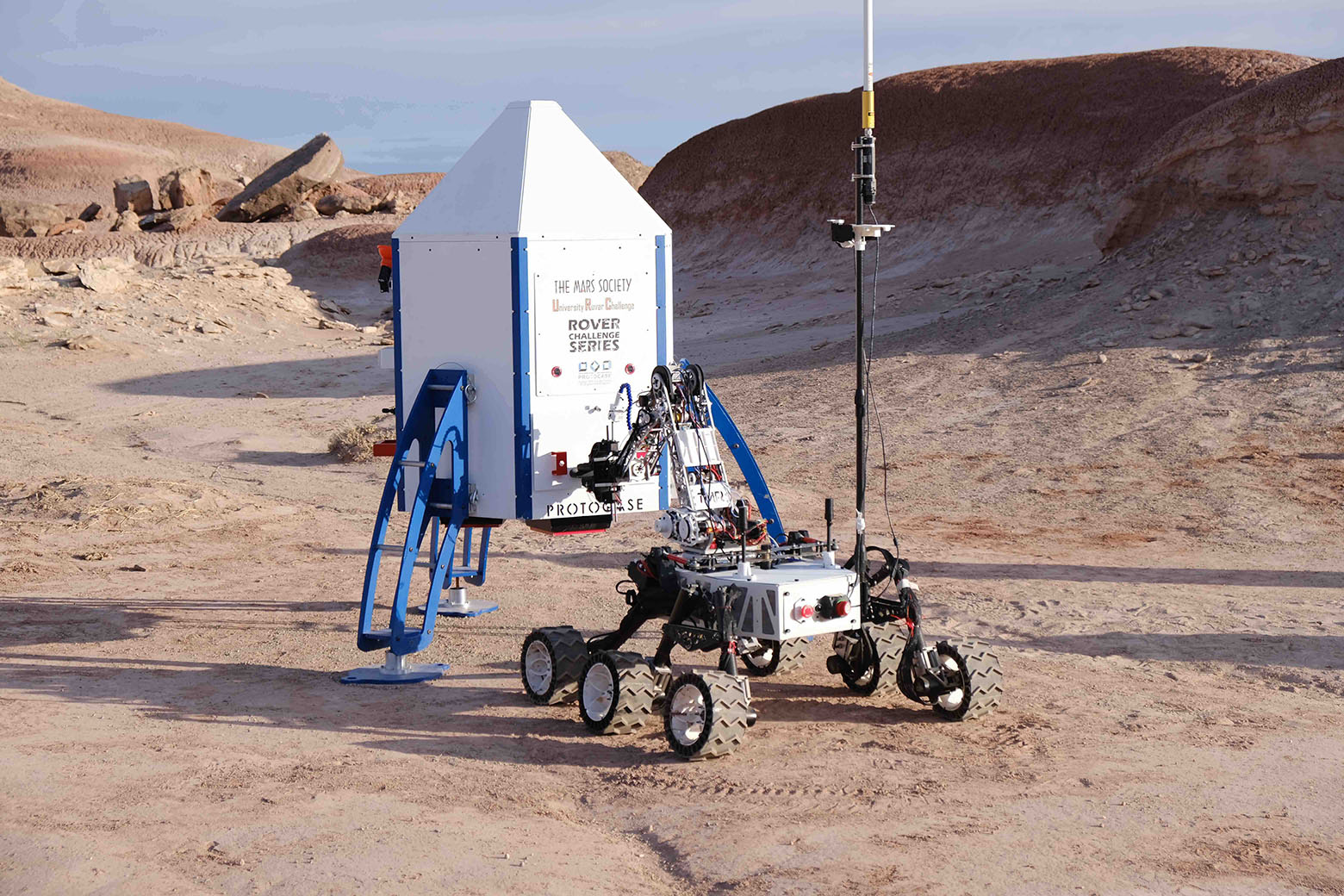 Toronto MetRobotics' University Rover Challenge rover on a simulated Mars landscape.
