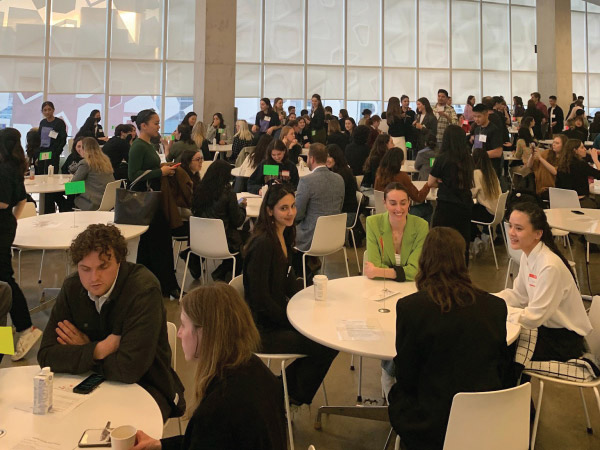 A group of students and professionals network during the Creative Industries' Industry Connect event.