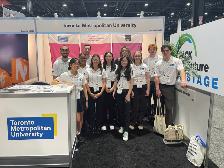 Group of GCM students at the TMU Exhibitors booth at the PACK EXPO International exhibition in Chicago.