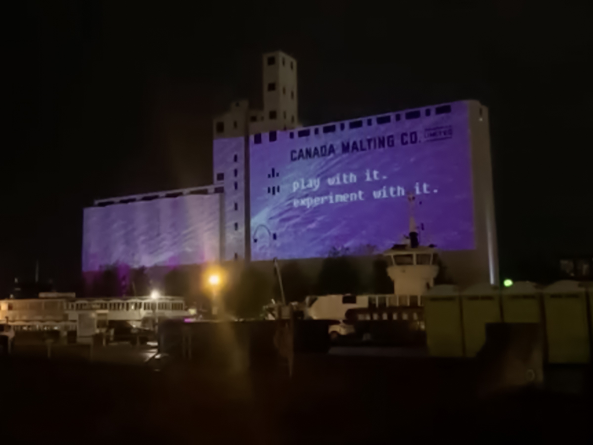 Student Ranjit's artwork projected on the wall of Toronto's Malting Silos