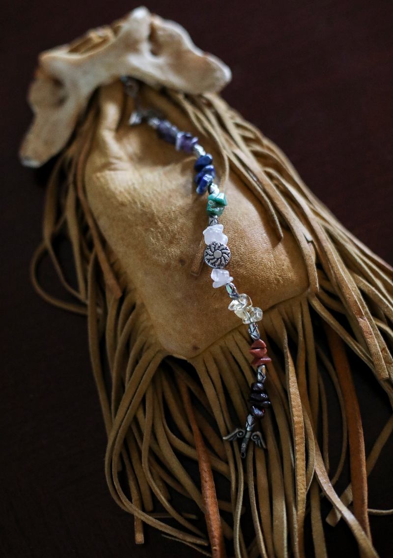 A medicine bag with beads and fringe
