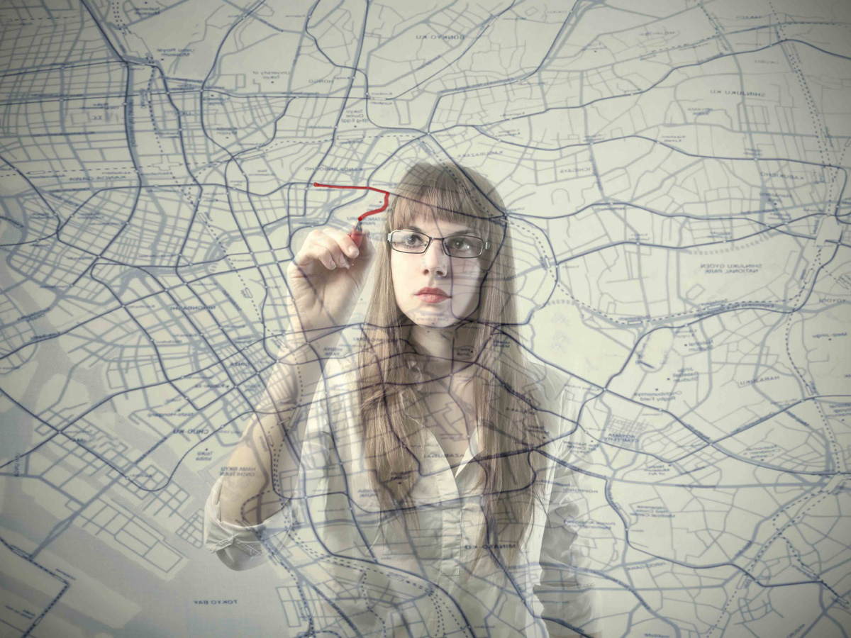 Woman planning goals on a transparent board