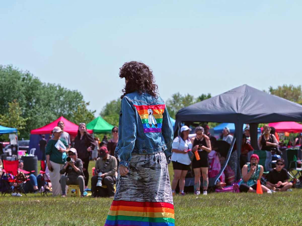 TMU two-spirit student proudly wearing rainbow colours