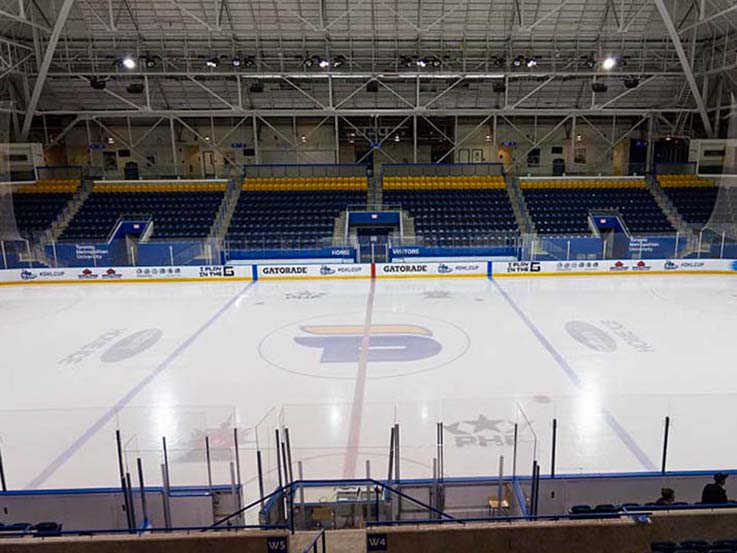Mattamy home ice with Rams logo in the centre. There is no one playing on the ice and nobody in the surrounding seats.