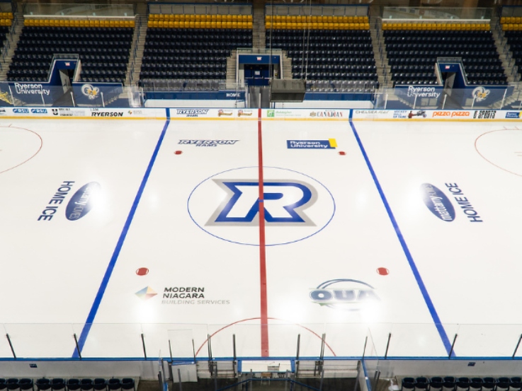 Mattamy home ice with Rams logo in the centre. There is no one playing on the ice and nobody in the surrounding seats.