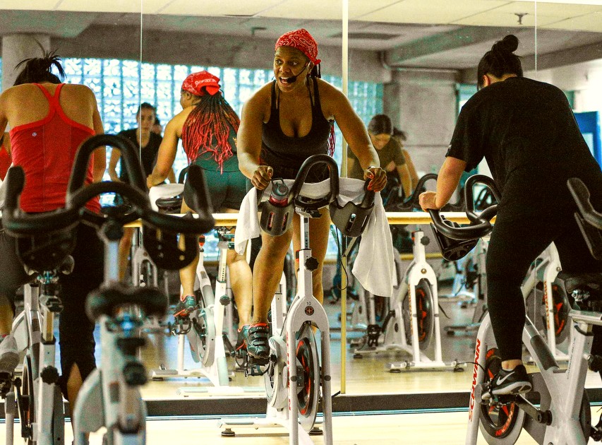 Instructor leads a spinning class at RAC studio 2.