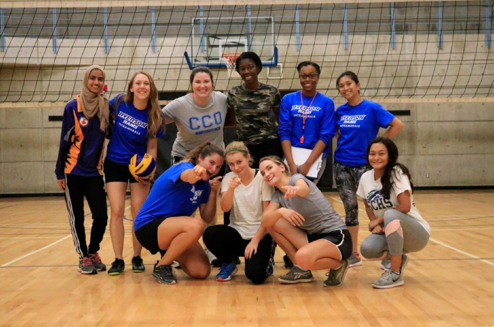 Women's intramural volleyball participants pose in one of the RAC gyms.