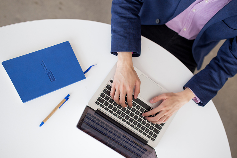 A student using a laptop on a table