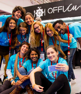 Group of students wearing team shirts taking a selfie at a Global Food Mission conference