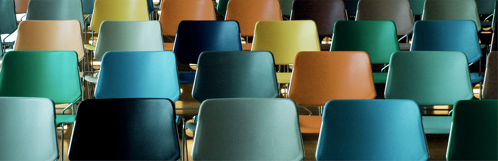 Colourful auditorium chairs.