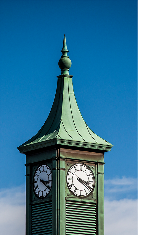 Close up of Kerr Hall's clock on TMU campus.