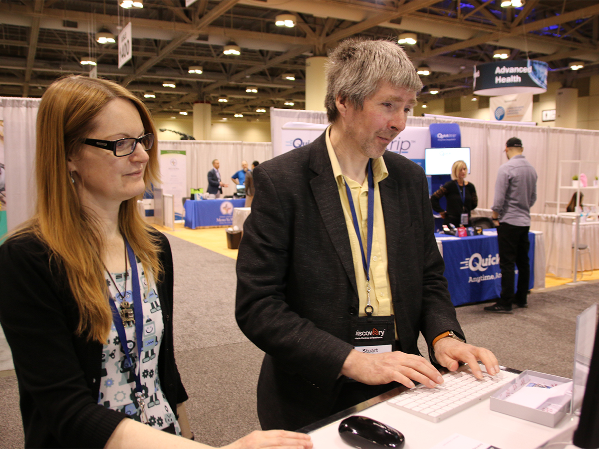 Two researchers type at a computer terminal at OCE Discovery