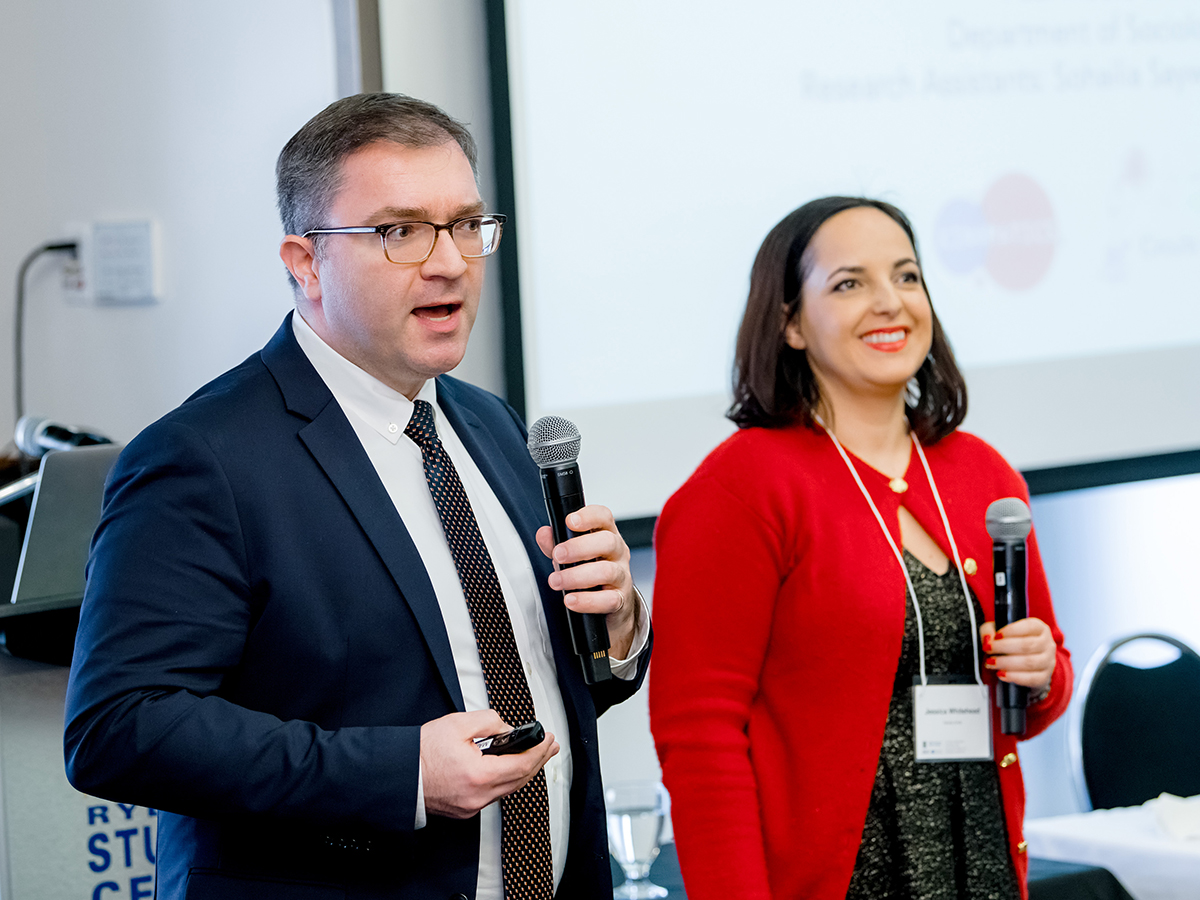  Paul Moore and Jessica Whitehead present their work at a panel focused on immigrant experiences in Canada