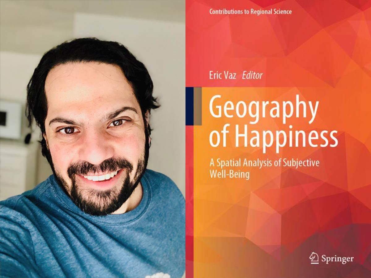 Professor Eric Vaz, a man with dark hair and a beard is smiling in a blue t-shirt. Beside his image is the orange book cover of Geography of Happiness: A Spatial Analysis of Subjective Well-being. 