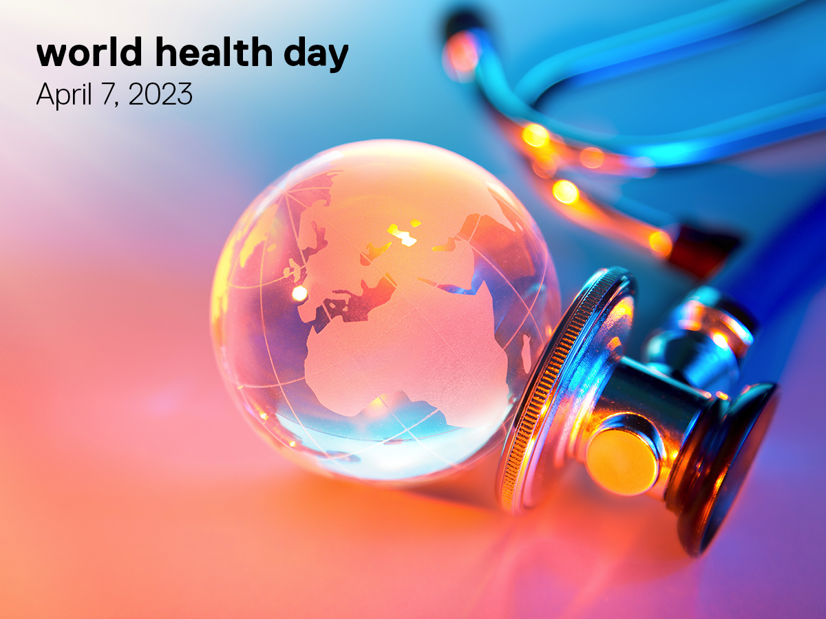 A stethoscope presses against a small marble model of a globe in a photo with a bright gradient filter including hues of orange, purple and blue. The image reads “World health day. April 7, 2023.”