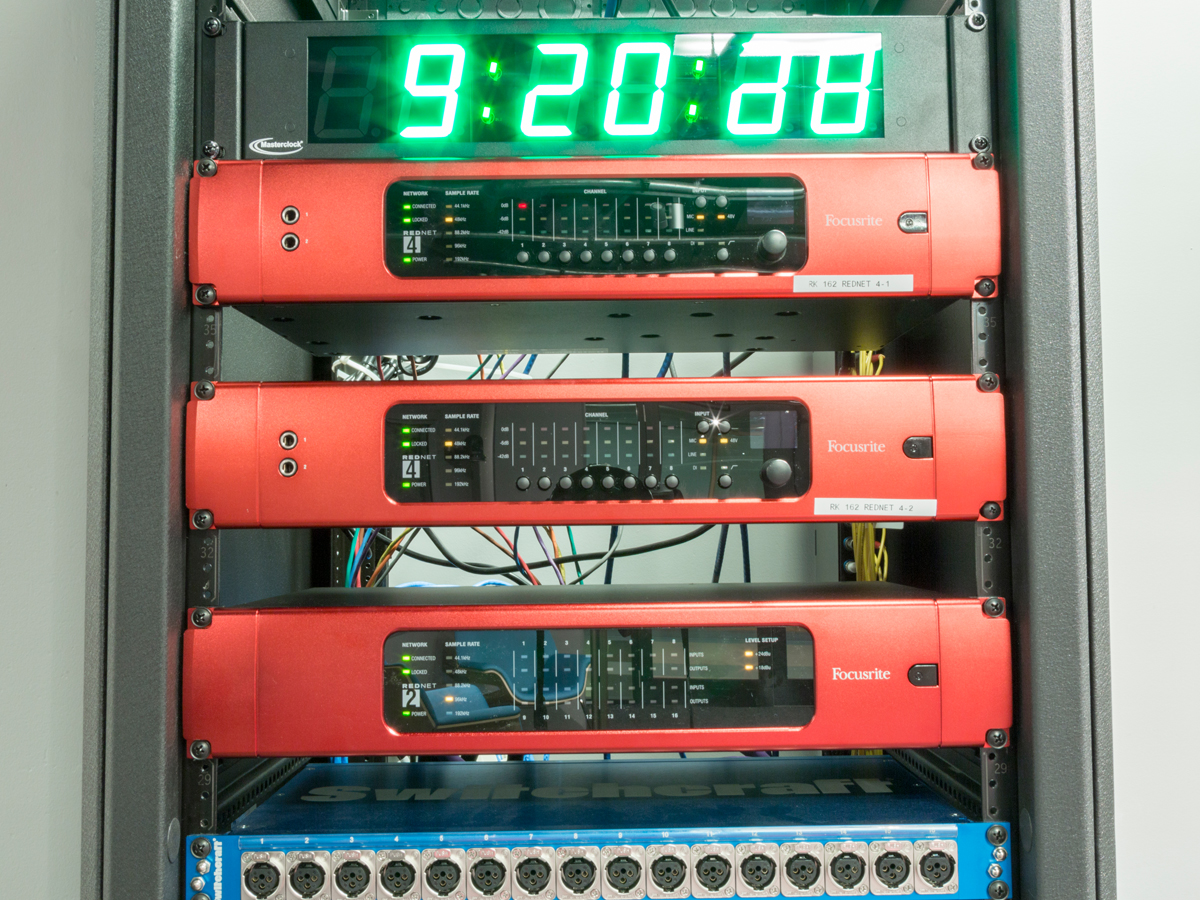 Radio equipment displays a time code alongside various ports and switches
