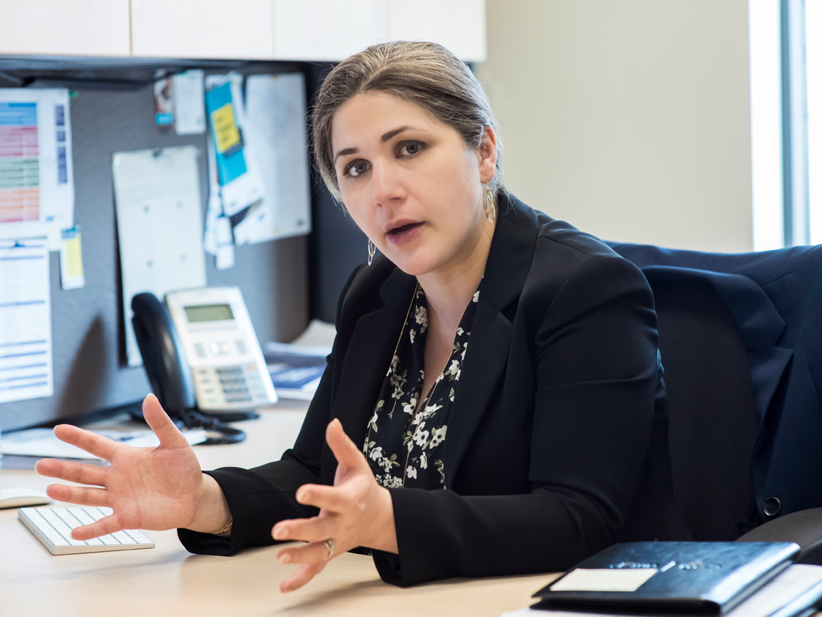 Professor Atty Mashatan sits at her desk