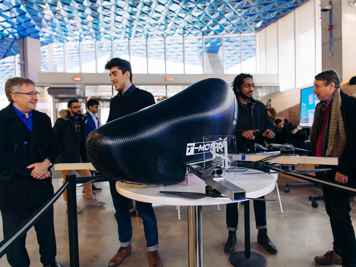 Ryerson students show off a personal flying device in the foyer of the Student Learning Centre