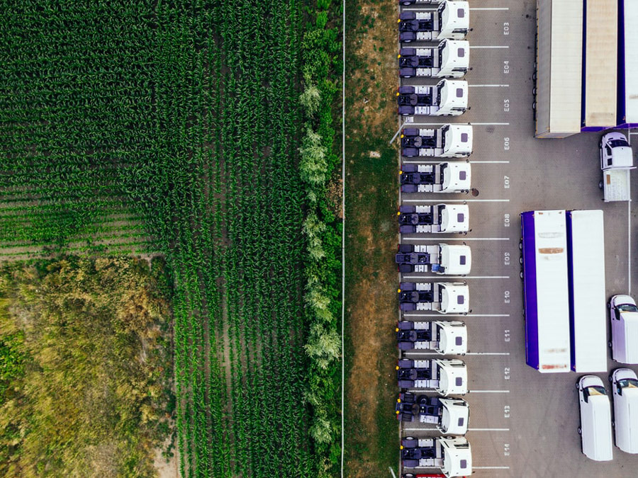 An aerial view of a farmer's field and a parking lot.