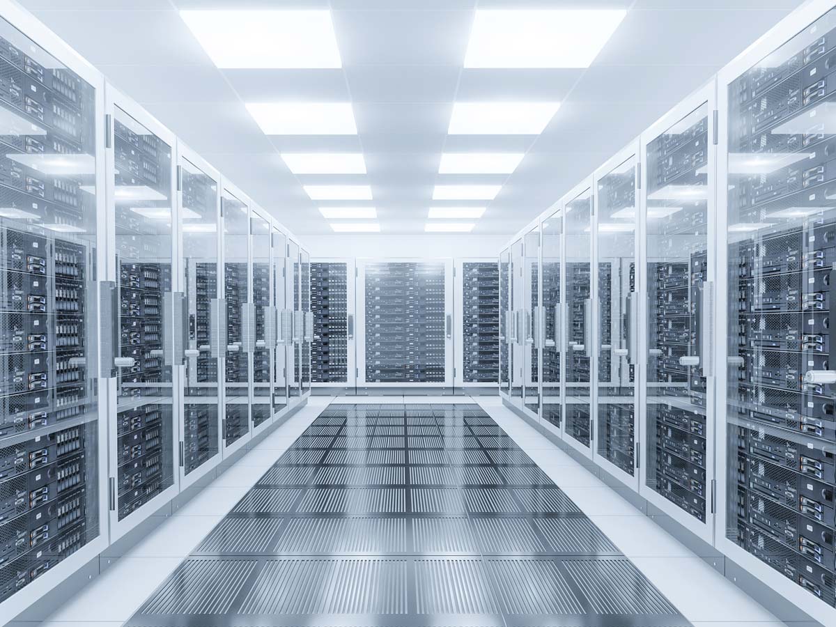 A futuristic white hallway lined with data servers behind glass doors. 