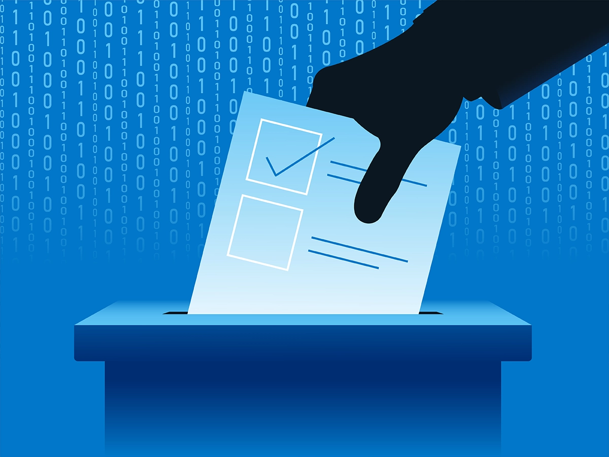 The silhouette of a hand inserts a ballot into a box against a backdrop of ones and zeroes.