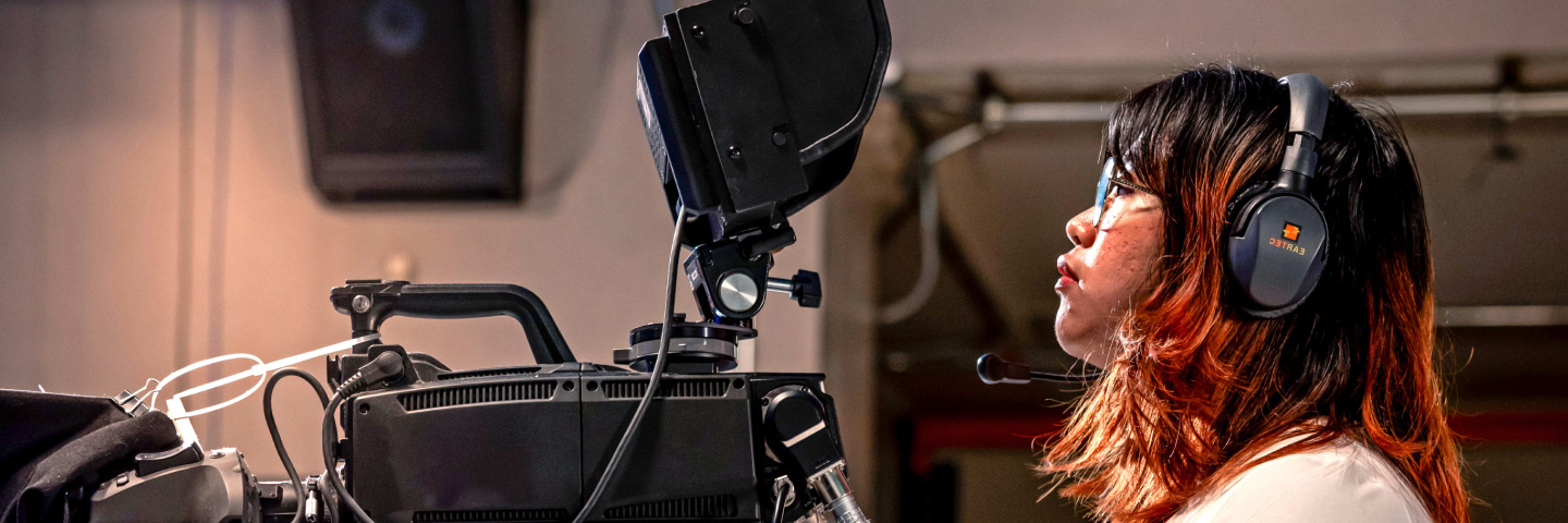 Student working with a camera