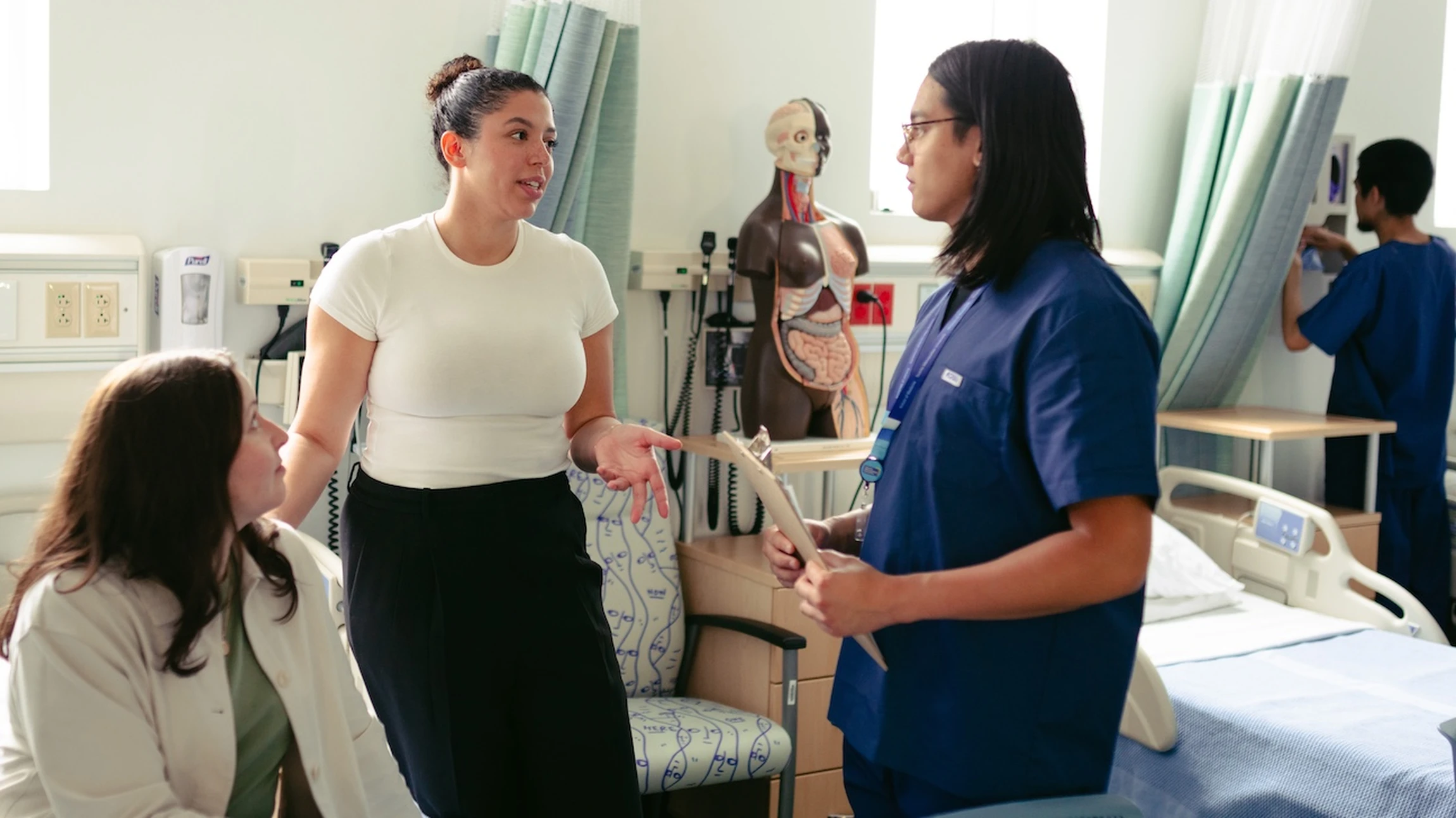 A female doctor examines a child's wrist