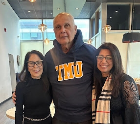 Three people posing for a photo.