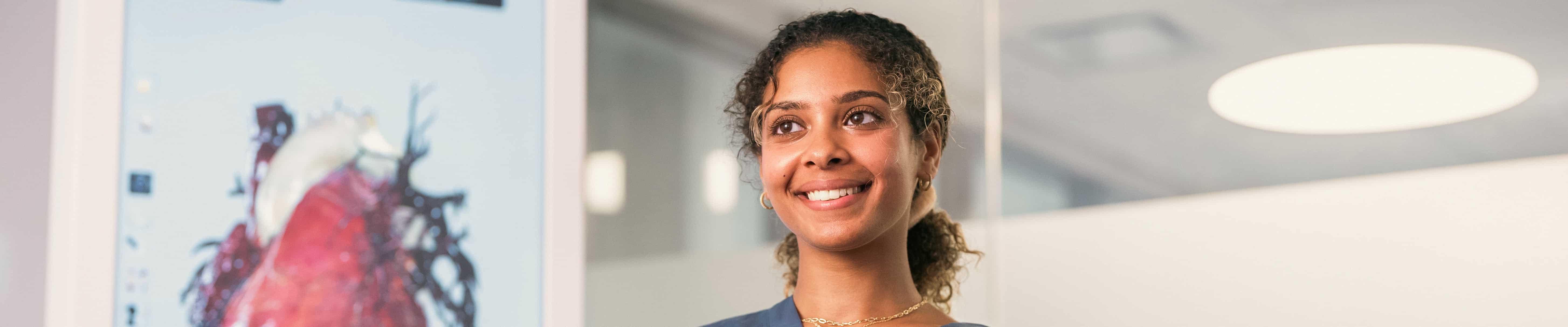 A confident, smiling female physician