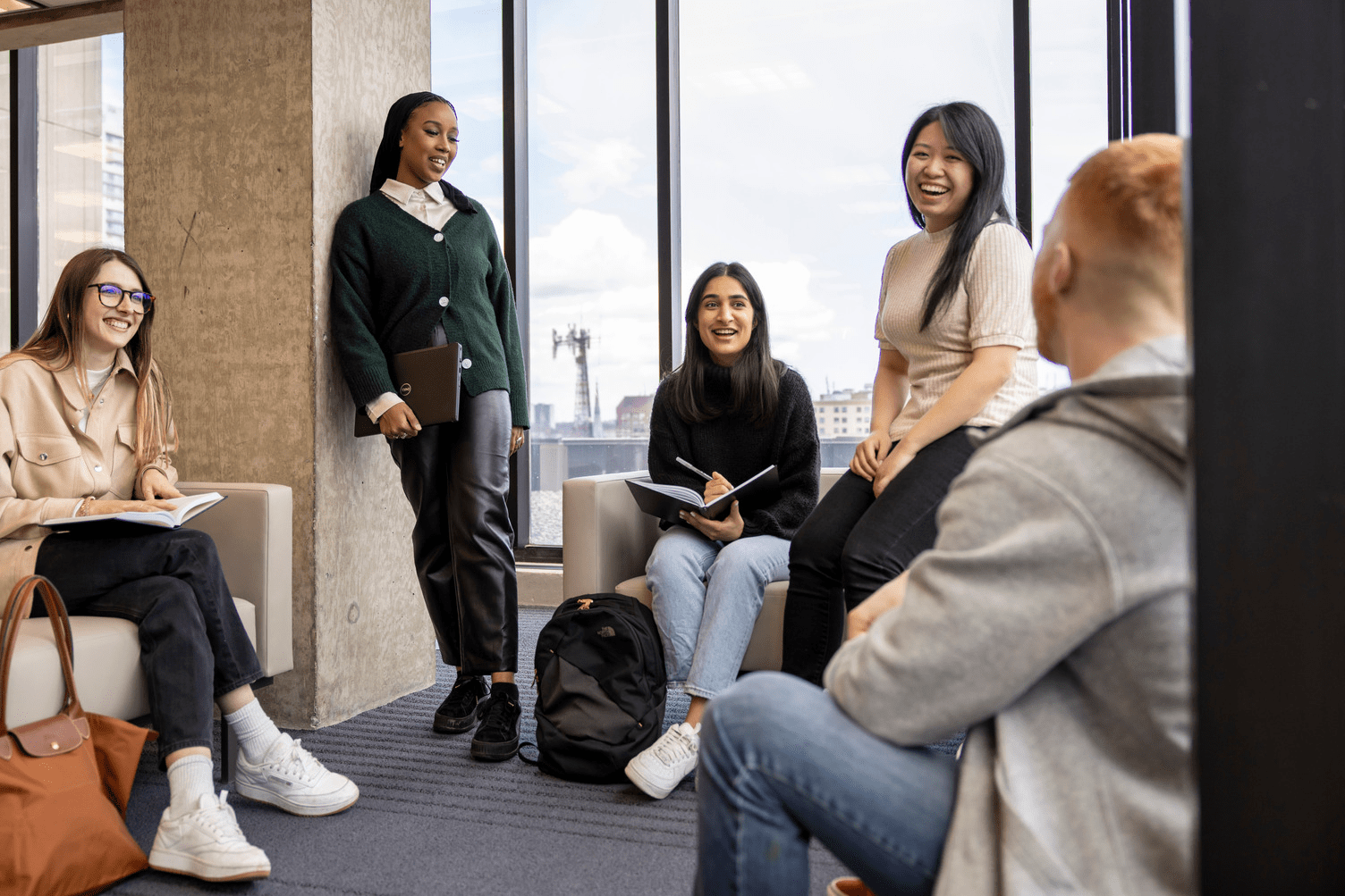 A diverse group of students talking with each other