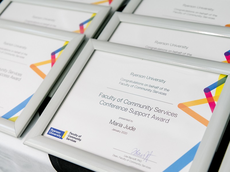 Faculty of Community Services conference support award plaques displayed on table