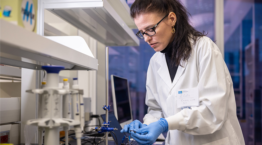 Woman in lab coat working in lab