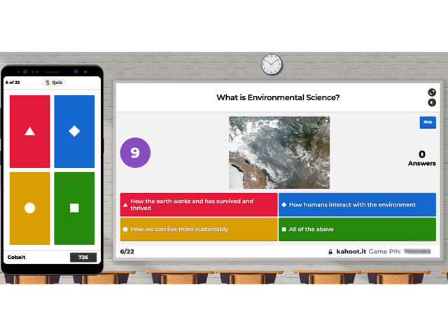 Screen grab of Kahoot. The phone screen is what players choose their answers with, and the large screen is the question and answer options.