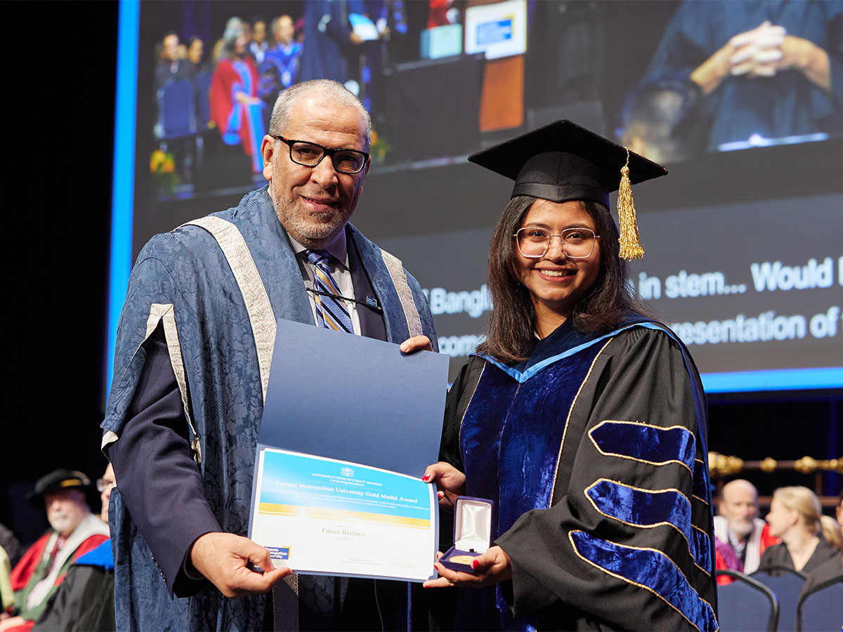 Fateen Basharat holding gold medal beside President Lachemi