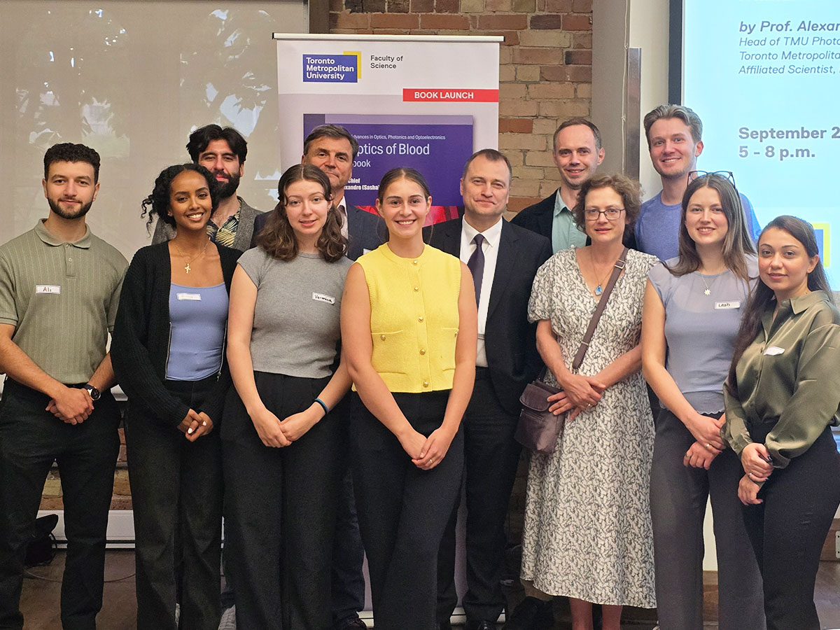 Dr. Douplik and his students and collaborators at the book launch