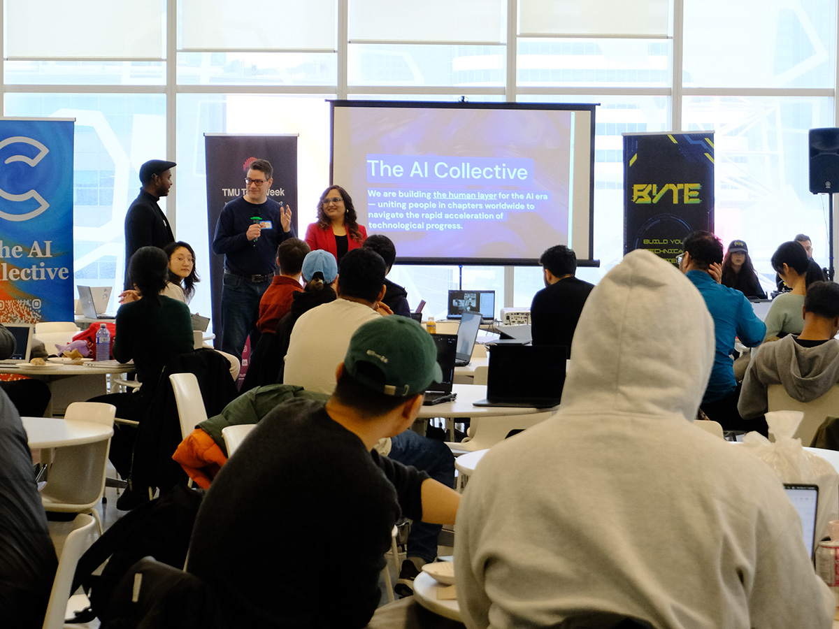Students sitting on a presentation by the AI Collective